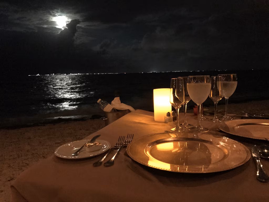 Enjoy an unforgettable moonlit private dinner on the beach at Excellence Playa Mujeres for true romance.