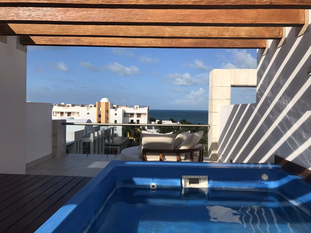 Enjoy ultimate relaxation with a private rooftop plunge pool overlooking the stunning Caribbean Sea views.