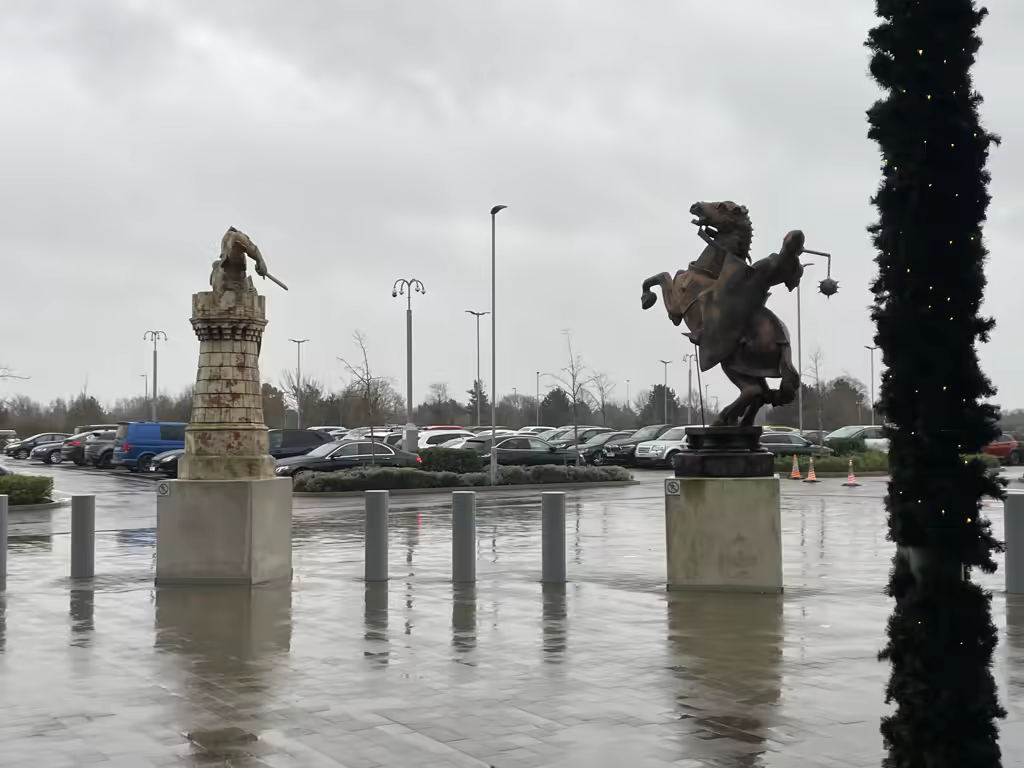 Statues of a knight and a mounted warrior at the Warner Bros. Studio Tour London entrance.