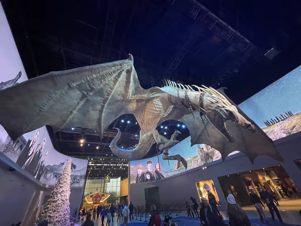 The massive, realistic dragon sculpture hanging in the studio lobby is an unforgettable sight for kids.