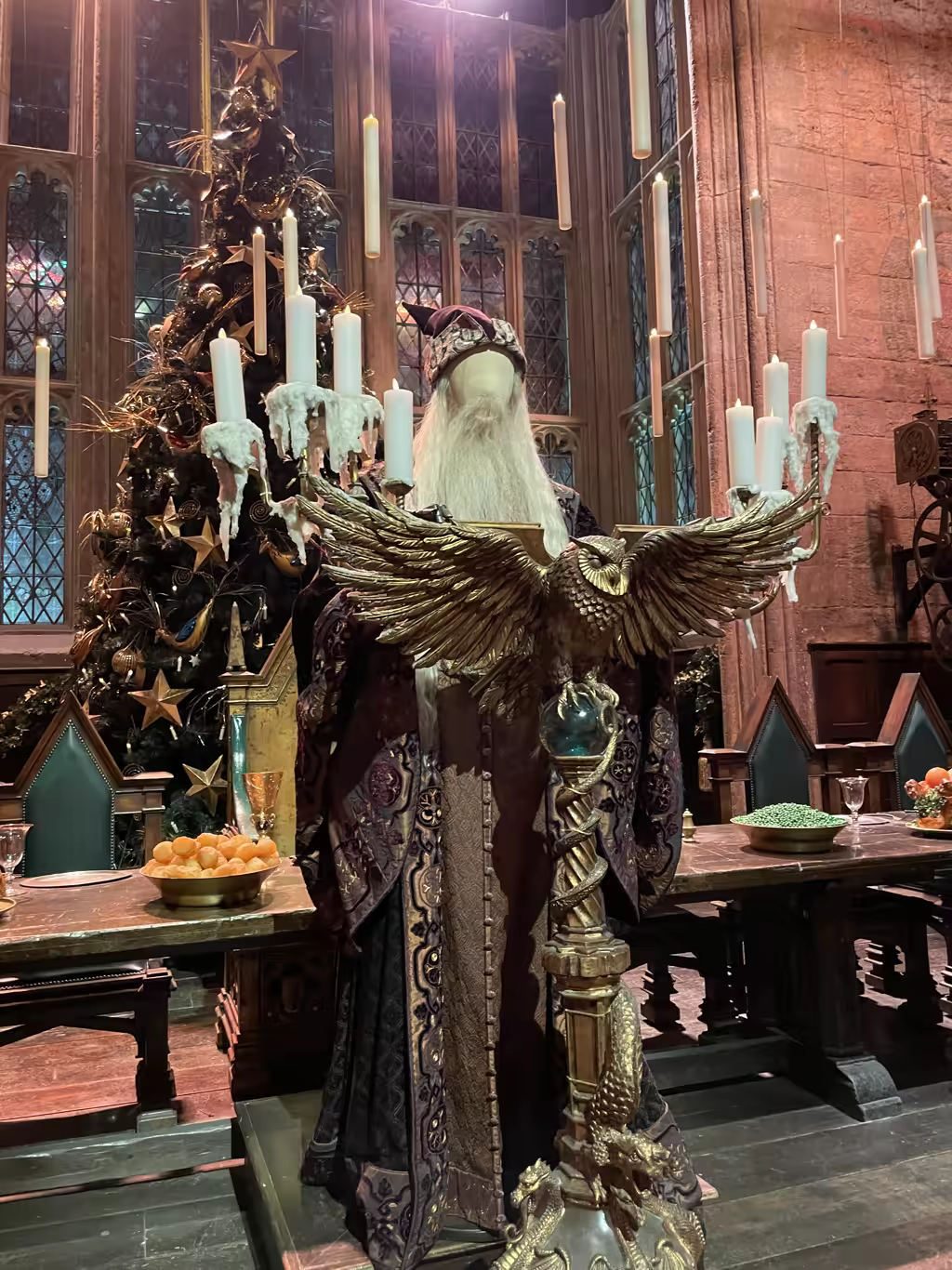 Step into the Great Hall, adorned for Christmas, featuring Dumbledore's iconic owl podium and festive decor.