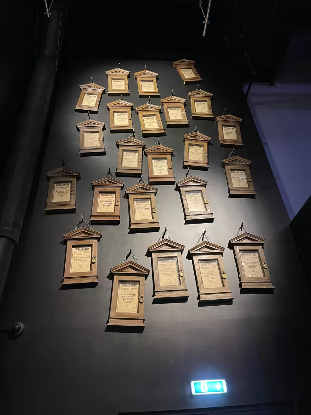 Educational Decrees displayed in wooden frames on a wall at the Harry Potter Studio Tour London.