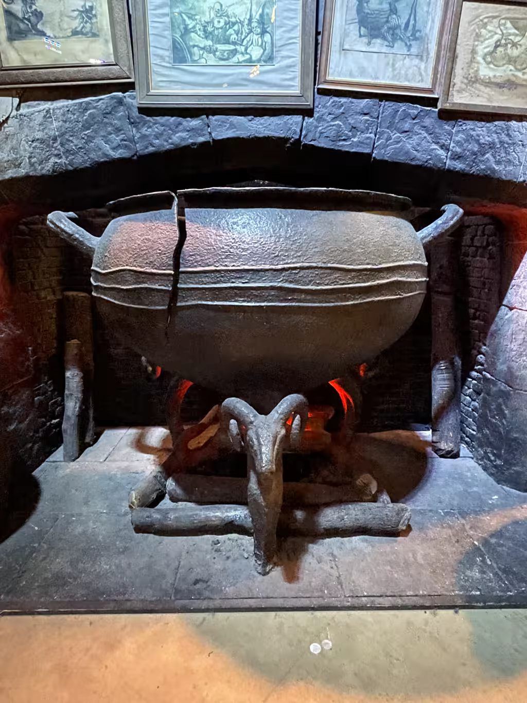 Get up close to the iconic, weathered cauldron standing prominently within the Leaky Cauldron film set.