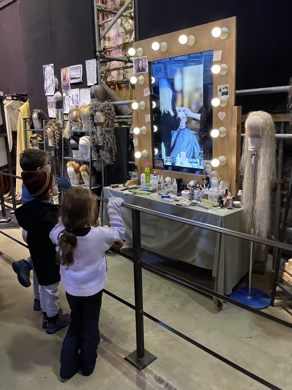 Kids enjoy a behind-the-scenes look at the wig and makeup department during the studio tour.