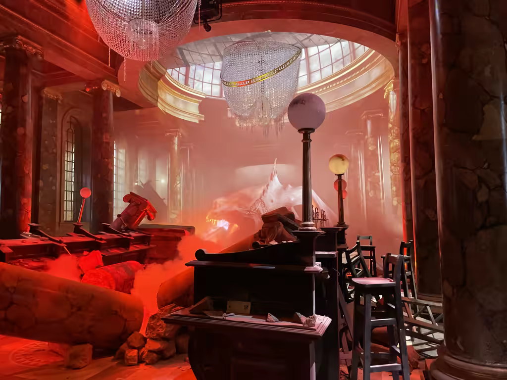 Experience the dramatic Gringotts Wizarding Bank set featuring the legendary dragon bursting through the grand lobby.