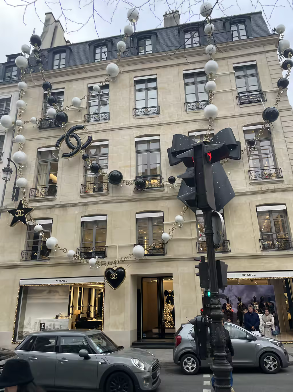 The festive Chanel boutique on Avenue Montaigne sparkles with oversized pearls and iconic holiday decorations.