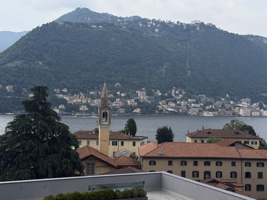 View of the town of Como, lake, and mountainous backdrop from the Hilton Lake Como hotel.