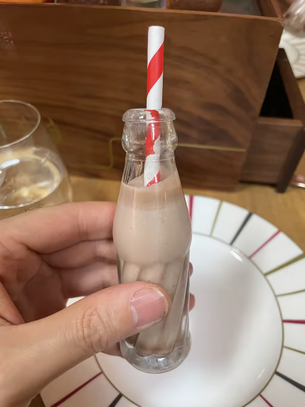 Sip on festive chocolate milk served in a mini vintage bottle at this London holiday tea.