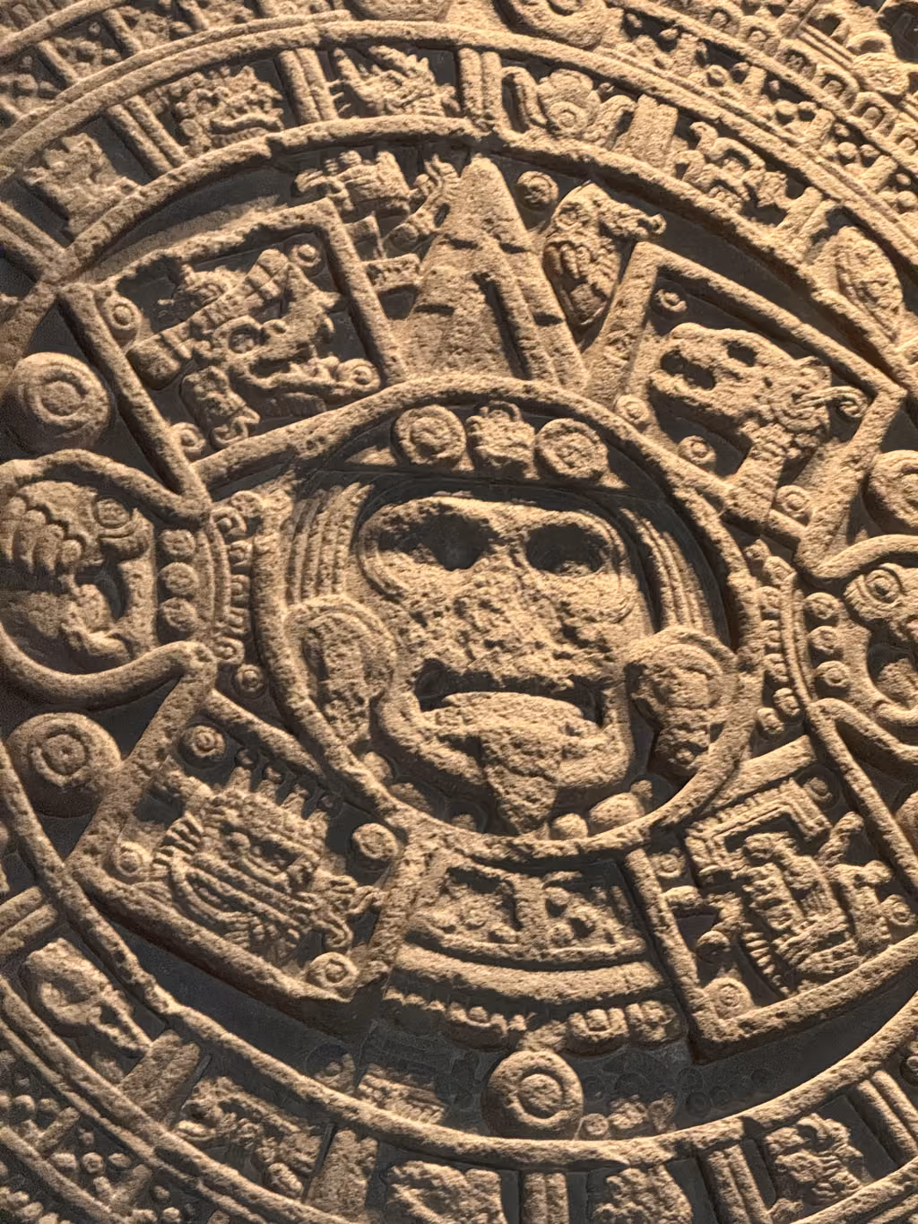 Close-up of the Aztec Sun Stone at the Templo Mayor museum in Mexico City.