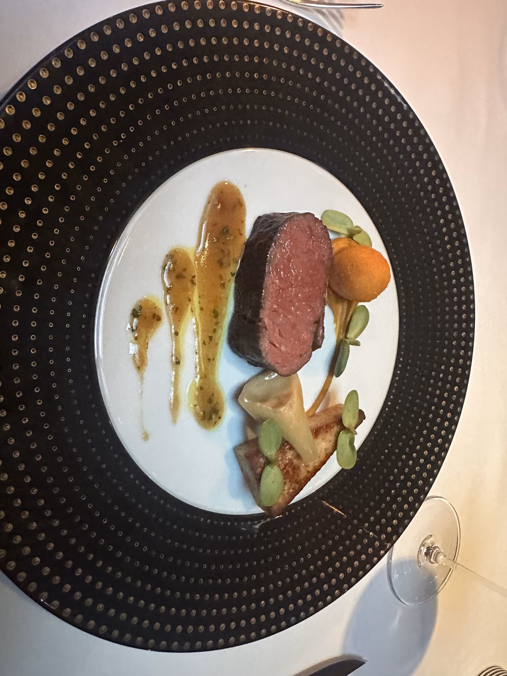 Savoring an exquisite, perfectly cooked tenderloin served as part of our memorable French Laundry birthday celebration.