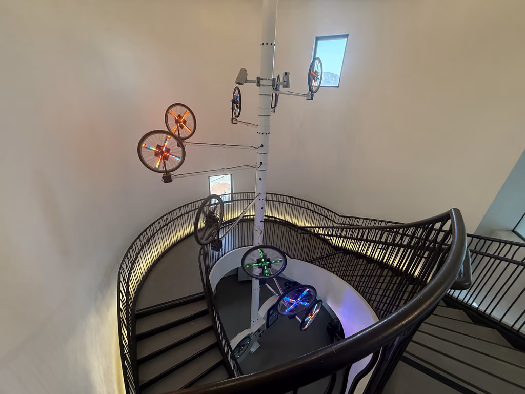 The Santa Barbara hotel's iconic spiral staircase features a unique, kinetic bicycle art installation overhead.