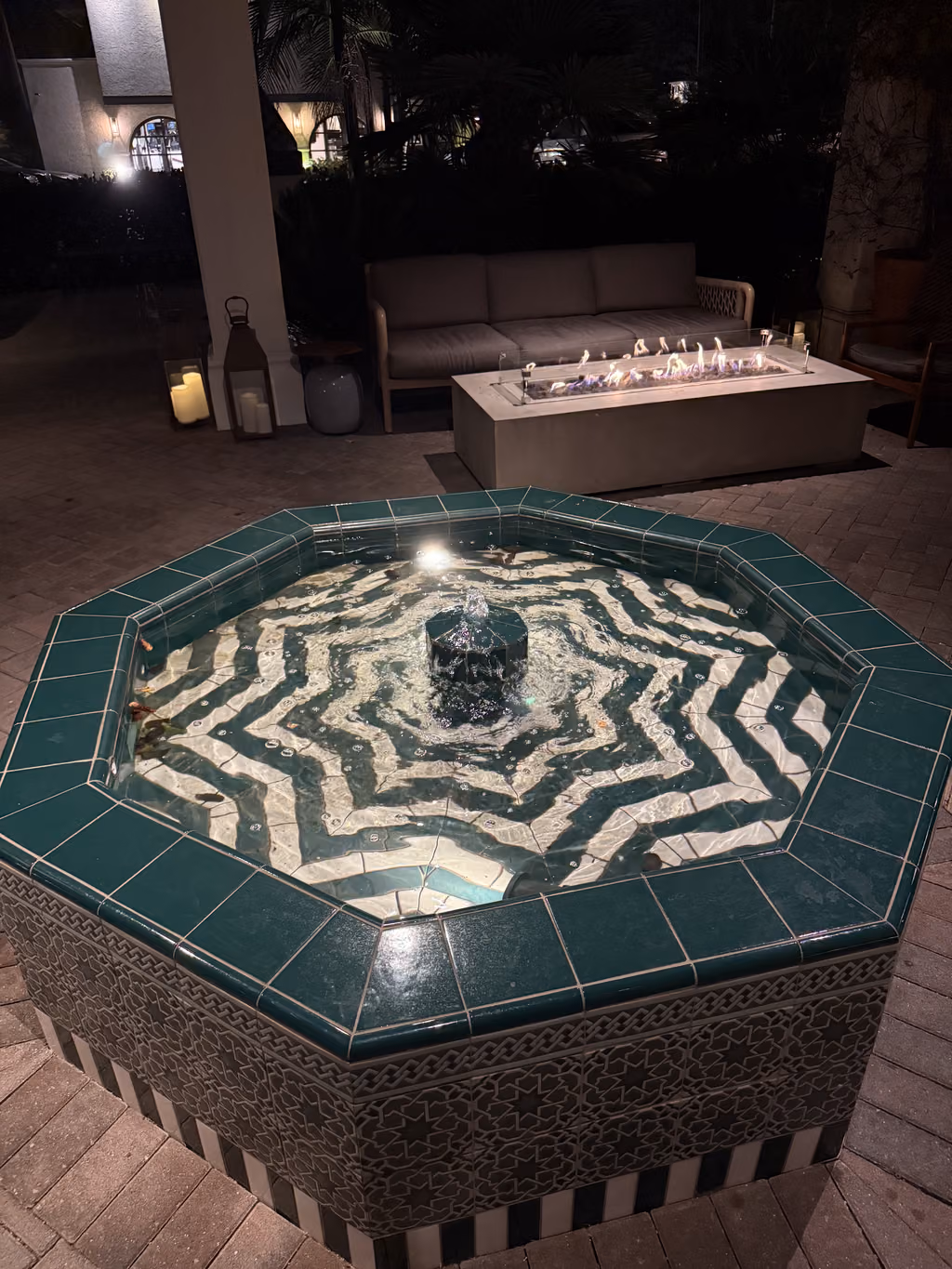 Relax by the stunning tiled fountain and cozy fire pit at this elegant Santa Barbara retreat.