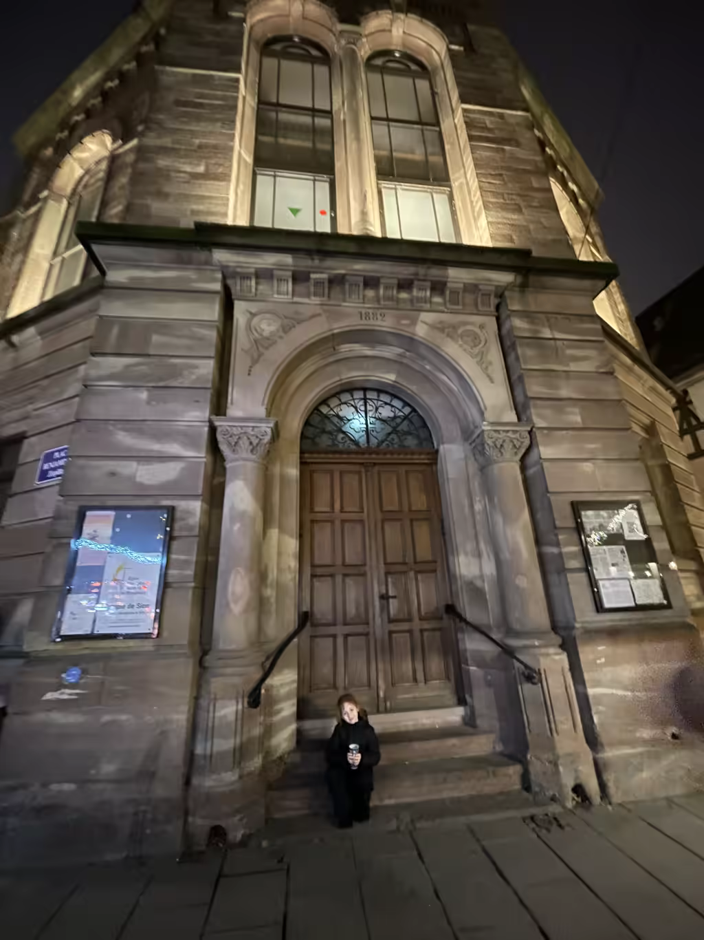 Enjoying a quiet, peaceful moment on the historic steps of an 1882 building in Strasbourg.