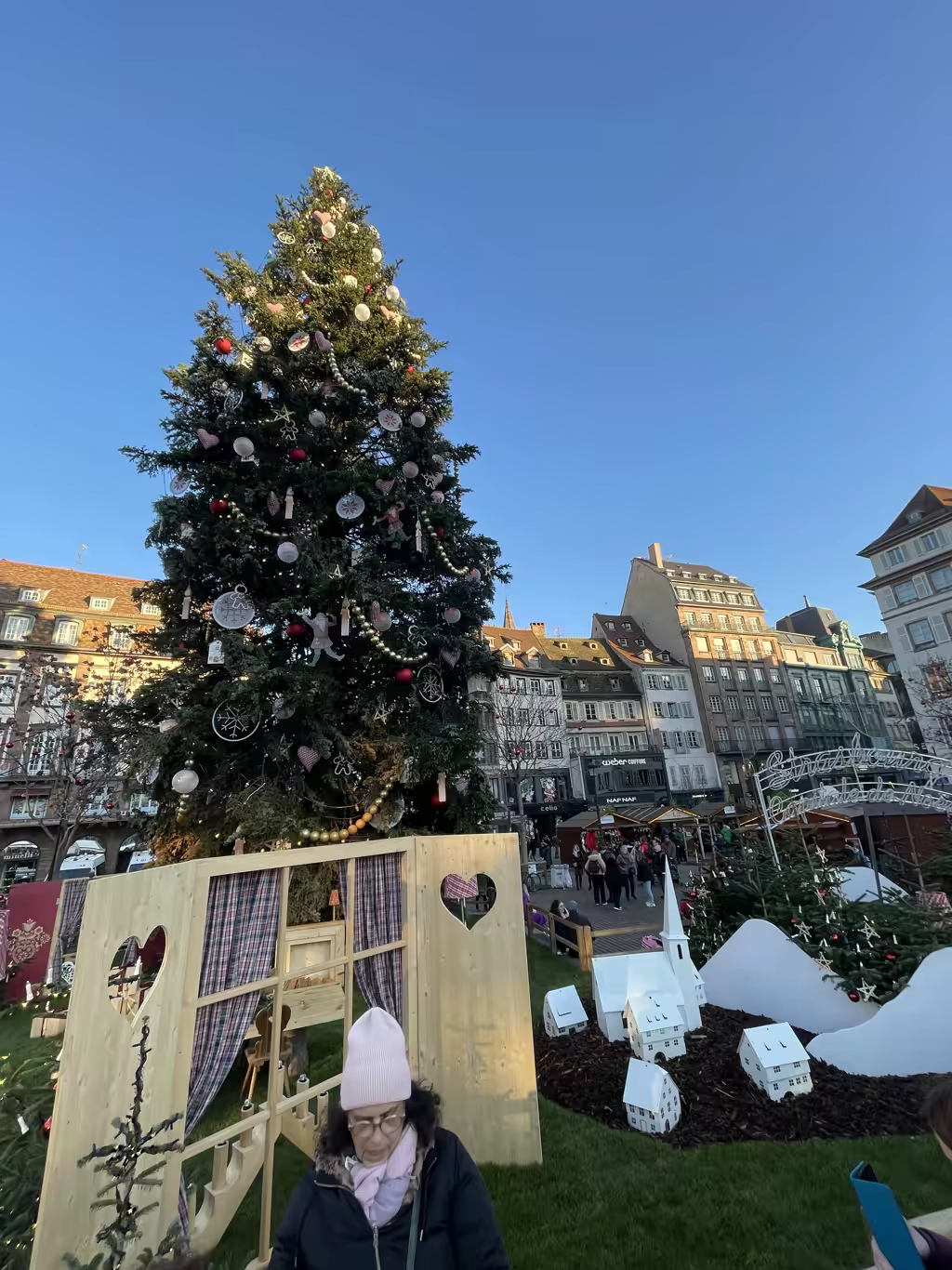 The towering Christmas tree in Place Kléber serves as a festive centerpiece for Strasbourg's magical market.
