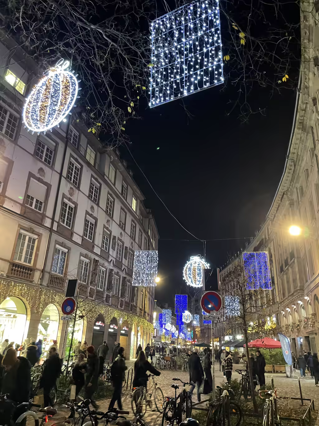 Sparkling holiday illuminations transform Strasbourg's historic streets into a magical evening stroll for visiting families.