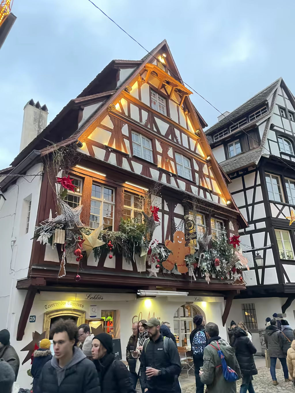 The charming, gingerbread-adorned Taverne des Tanneurs welcomes crowds in the heart of historic Colmar.