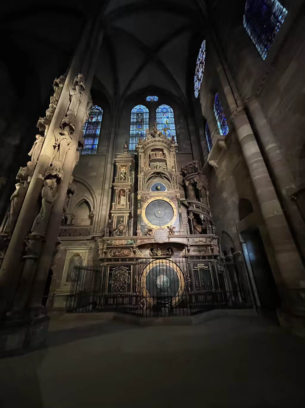 Marvel at the intricate mechanics of the astronomical clock inside the towering Strasbourg Cathedral at midday.